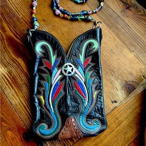 Eye catching one-of-a 
-kind leather boot bag with colorful beaded strap.